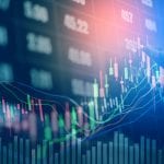 Businessman writing the trading graph of stock market on digital stock market financial exchange and Trading graph