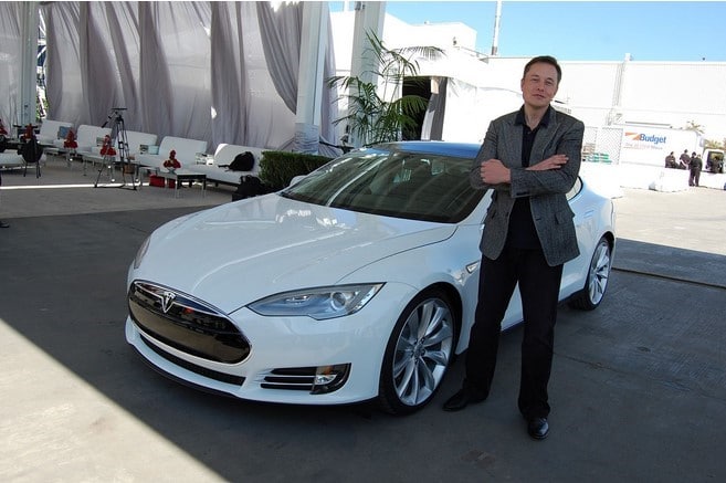 Elon Musk with a Tesla Model S