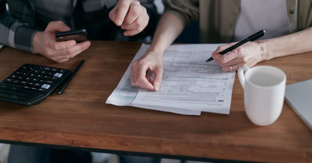 Financial planning documents showing ISA transfer forms and international tax considerations