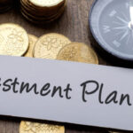 Investment planning concept with compass and coins