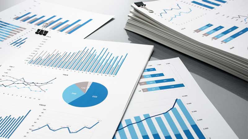 Financial reports with charts and graphs showing data analysis