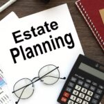 Estate planning documents and calculator on wooden desk