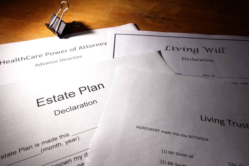 Estate planning documents including living will and trust papers