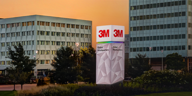 3M Global Headquarters building at dusk with illuminated company signage