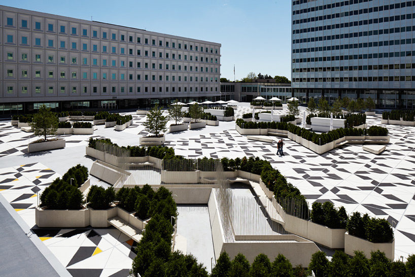 3M corporate campus outdoor plaza with geometric landscaping and modern office buildings