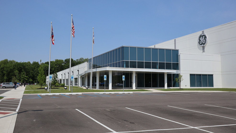 GE Aerospace corporate headquarters building with American flags and company logo