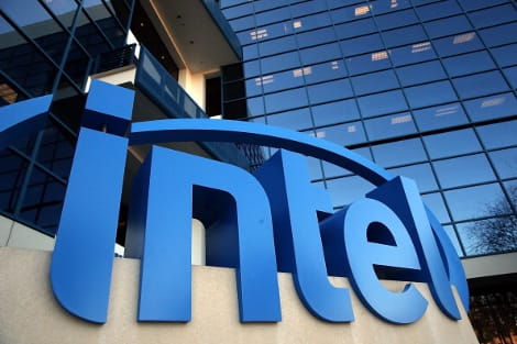 Intel's classic logo with swoosh design at corporate facility entrance