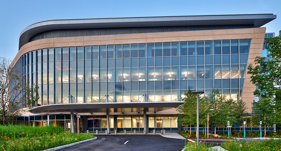 Regeneron headquarters at dusk with illuminated windows