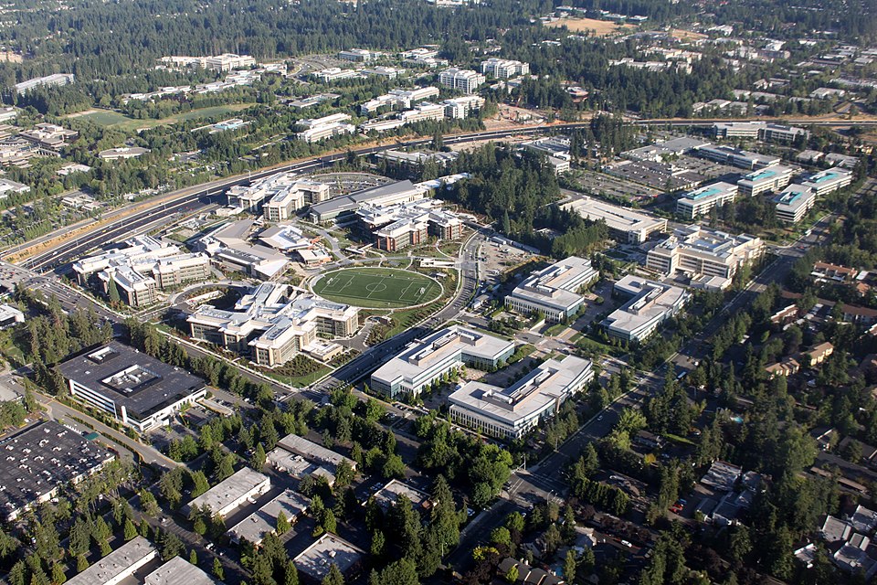 Microsoft headquarters campus in Redmond, Washington, showing modern glass buildings with Microsoft logo