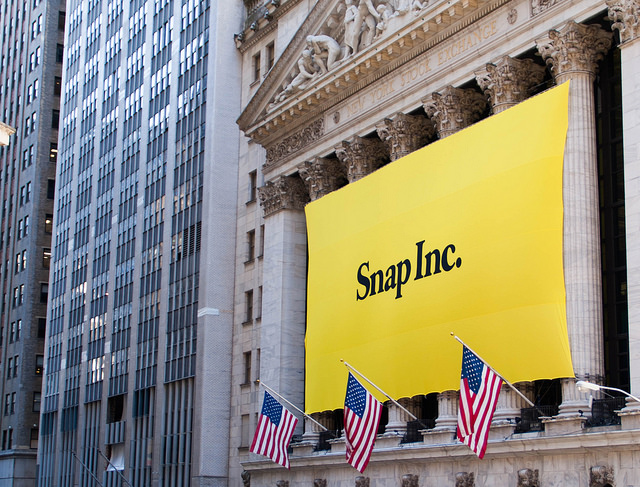 New York Stock Exchange building decorated with Snap Inc. banner during company's IPO celebration