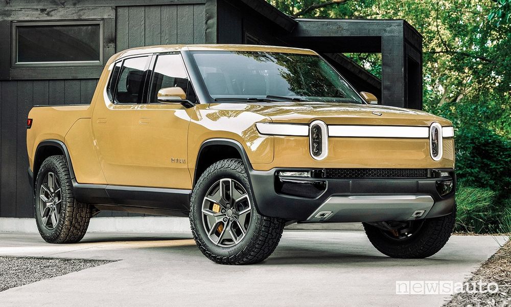 Rivian R1T in Compass Yellow color parked in front of modern residential home