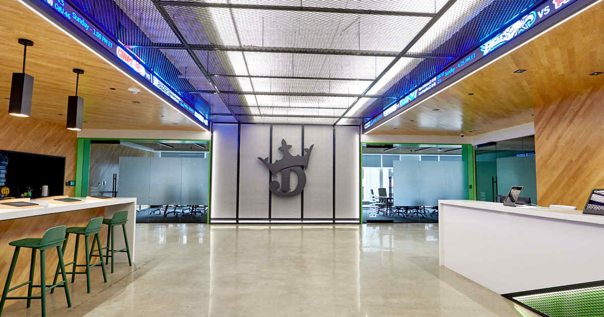 DraftKings corporate headquarters reception area with modern design and sports-themed digital displays