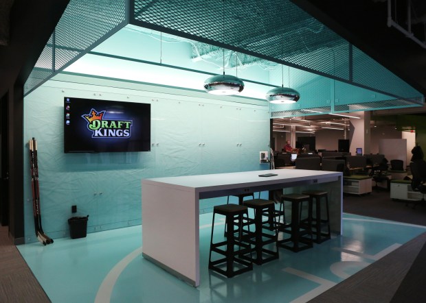 DraftKings office hockey-themed breakout area with ice rink design and DraftKings logo display