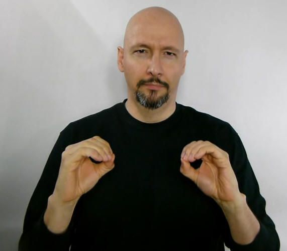 Professional man making ASL sign for zero or nothing with both hands