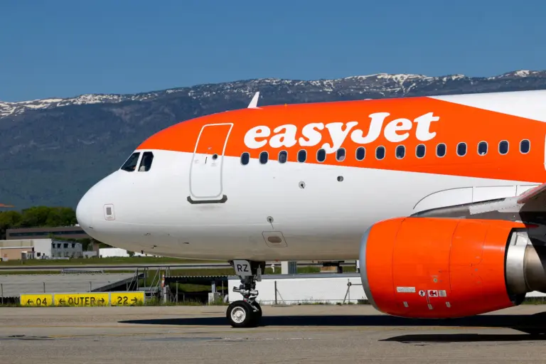 An orange-and-white easyJet Airbus aircraft on the tarmac, illustrating coverage of the Apollo takeover deadline extension.