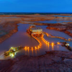 Kenmare Resources' Moma mineral sands mine site in Mozambique, showing dredge mining equipment and processing infrastructure.