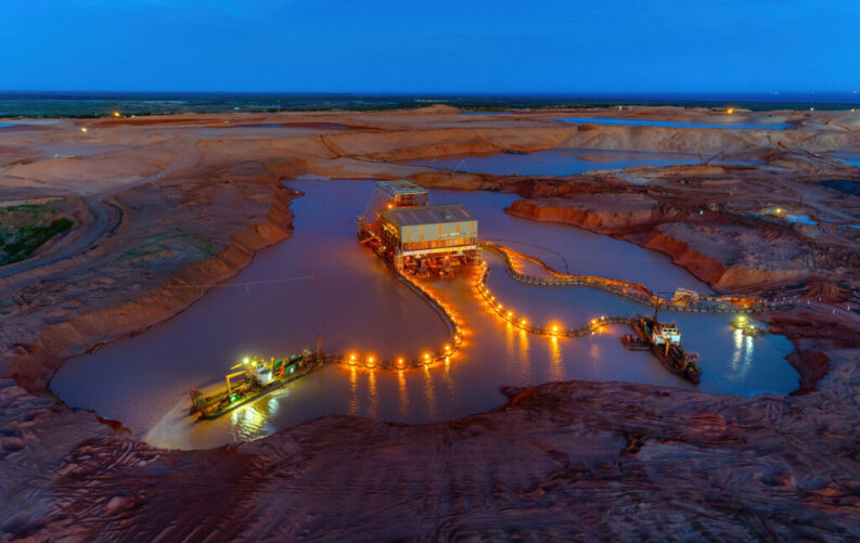 Kenmare Resources' Moma mineral sands mine site in Mozambique, showing dredge mining equipment and processing infrastructure.