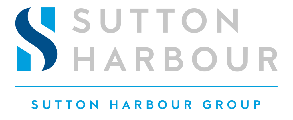 Panoramic view of Sutton Harbour marina with moored boats and quayside buildings