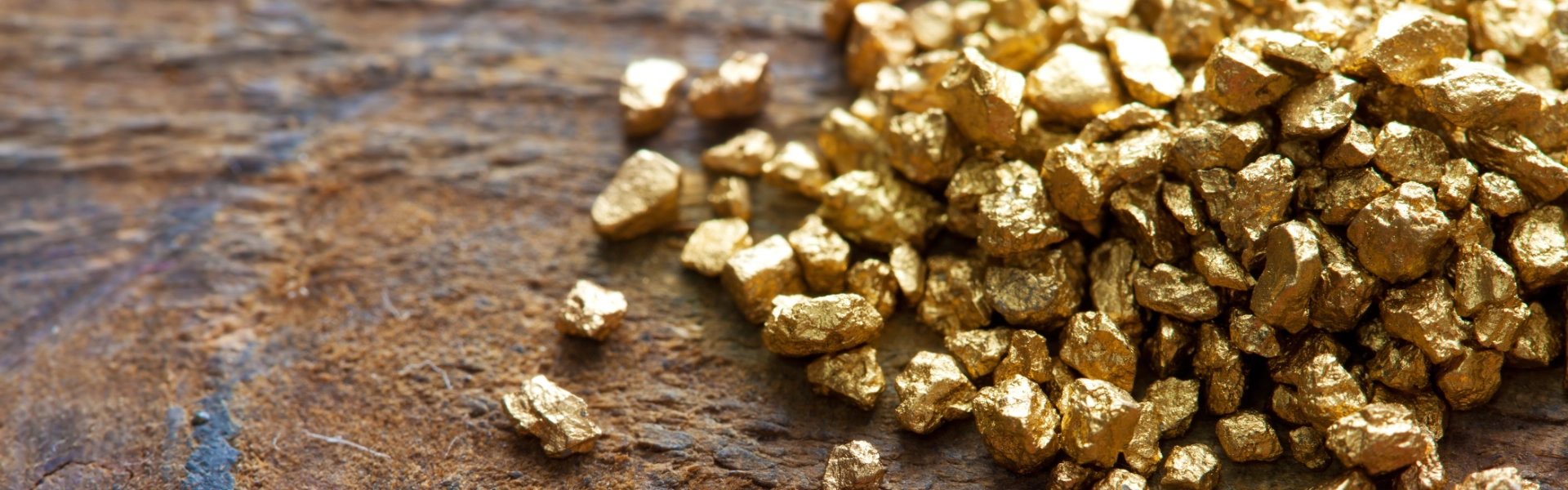 Close-up of raw gold nuggets, symbolising precious metals investment