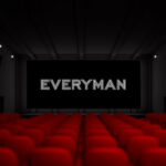 Illustration of an Everyman Cinema auditorium with red seating facing a screen displaying the Everyman logo