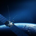 Illustration of a satellite orbiting above Earth, representing satellite communications technology