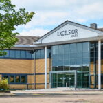 Excelsior House office building exterior with brick facade, glass entrance, and 'Excelsior House' signage