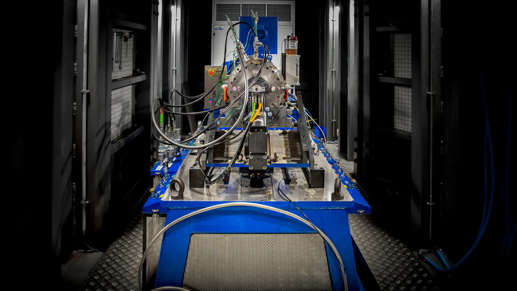 Close-up photograph of precision industrial engineering equipment on a test rig inside a workshop