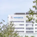 Novartis logo displayed on the Banting 1 building at the Novartis Campus in Basel, Switzerland
