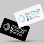 Cambridge Nutritional Sciences company logo displayed on white and black branded cards