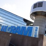 Ingram Micro corporate headquarters building in Irvine, California, with company signage visible.