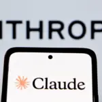 Smartphone showing the Claude logo in front of a blurred Anthropic wordmark
